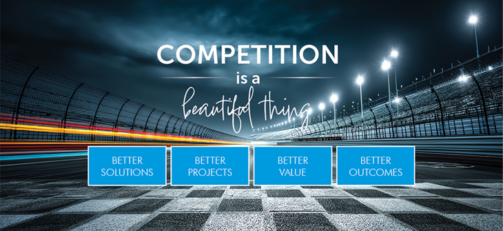 Racetrack at night with signs reading: Better Solutions, Better Projects, Better Value, Better Outcomes.
