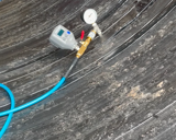 Inside view of corrugated metal pipe. 