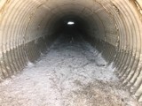 Inside view of corrugated metal pipe.