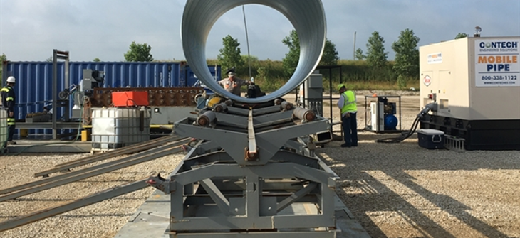 Contech's MOBILE-PIPE mill manufacturing corrugated metal pipe. 