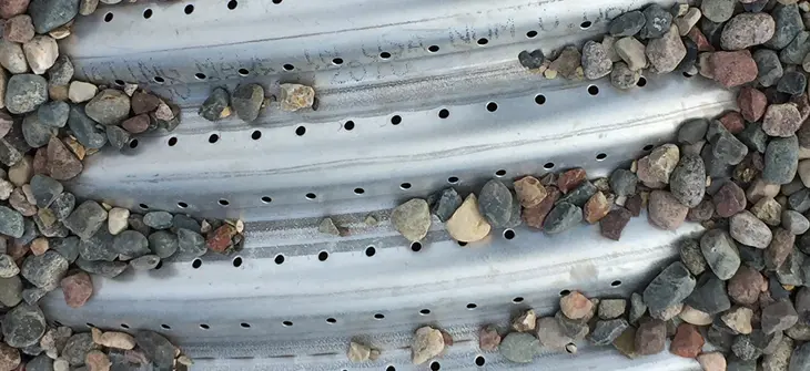 image of Stones on Perforated Pipe