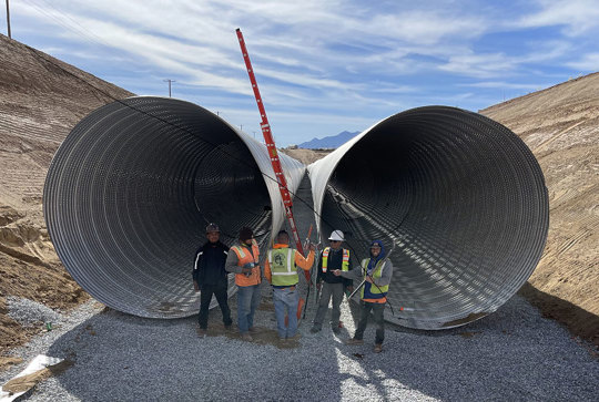 Installation of a large diameter corrugated metal pipe stormwater detention system.