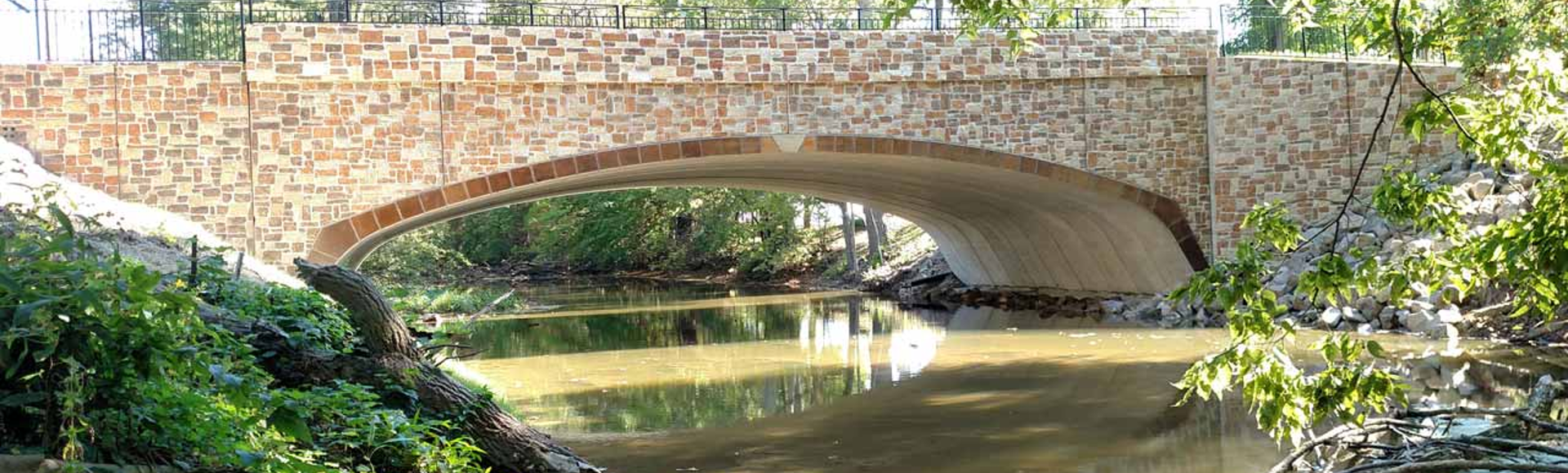 A CON/SPAN O-Series precast bridge over a stream. 