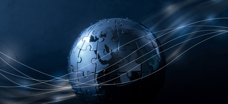 A globe made of metallic puzzle pieces with flowing light trails on a dark background.