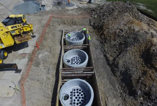 Installation of three Jellyfish stormwater filtration devices.