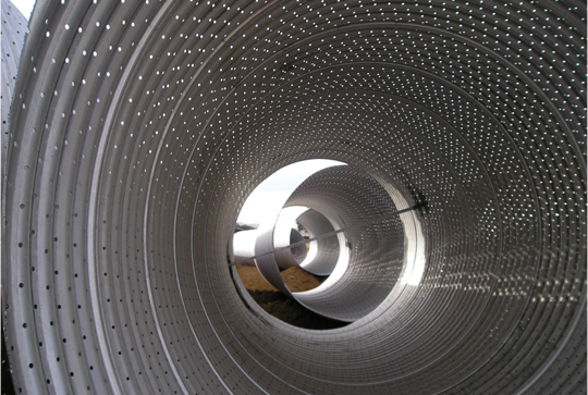 Perforated corrugated metal pipe.